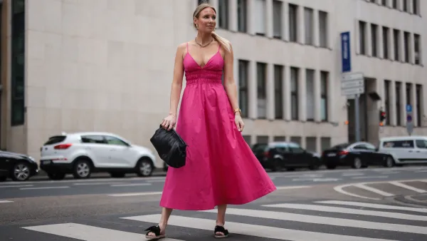COLOGNE, GERMANY - MAY 12: Sarah Achterholt wearing pink Zara dress, black Isabel Marant pouch bag and black Manebi slides via The Wants Shoes on May 12, 2021 in Cologne, Germany. (Photo by Jeremy Moeller/Getty Images)