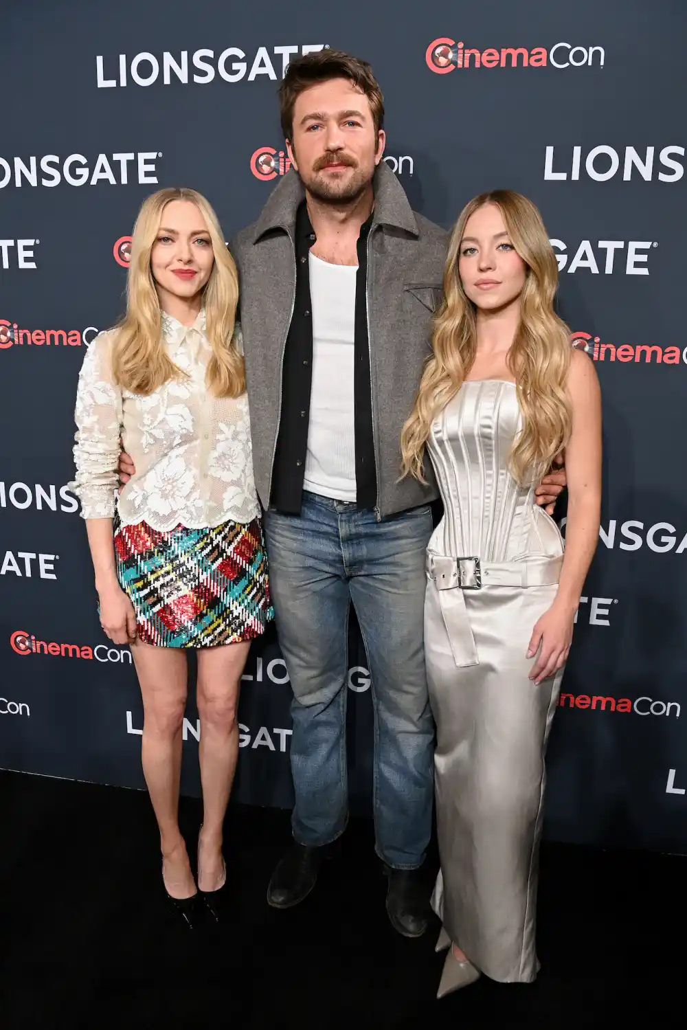 LAS VEGAS, NEVADA - APRIL 01: (L-R) Amanda Seyfried, Brandon Sklenar, and Sydney Sweeney attend the Lionsgate presentation during 2025 CinemaCon at Caesars Palace on April 01, 2025 in Las Vegas, Nevada.
