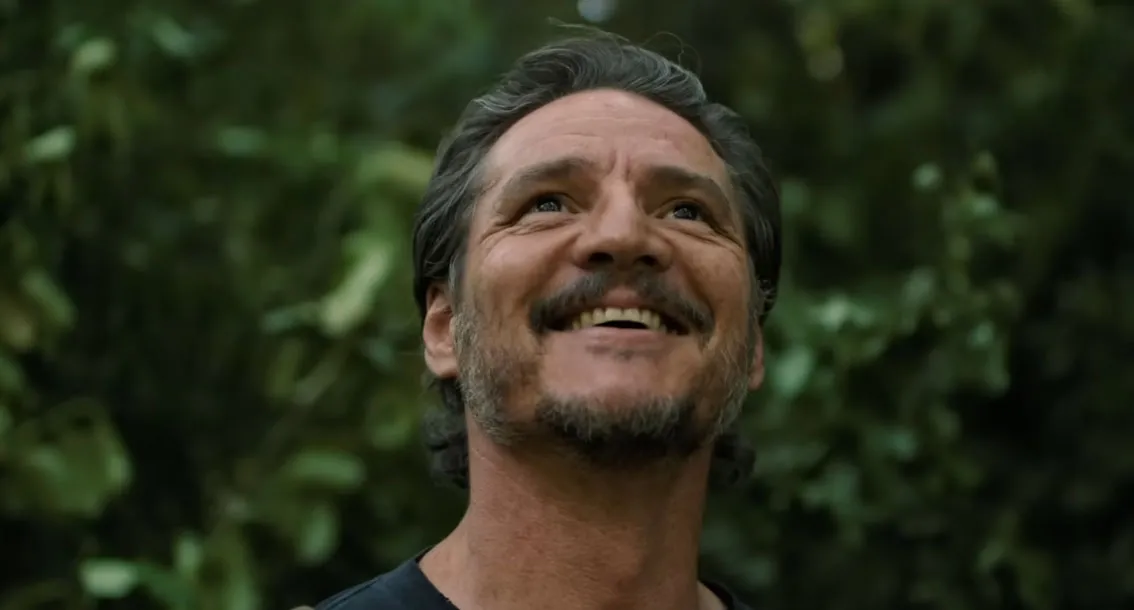 Pedro Pascal smiles in 'The Last of Us.'