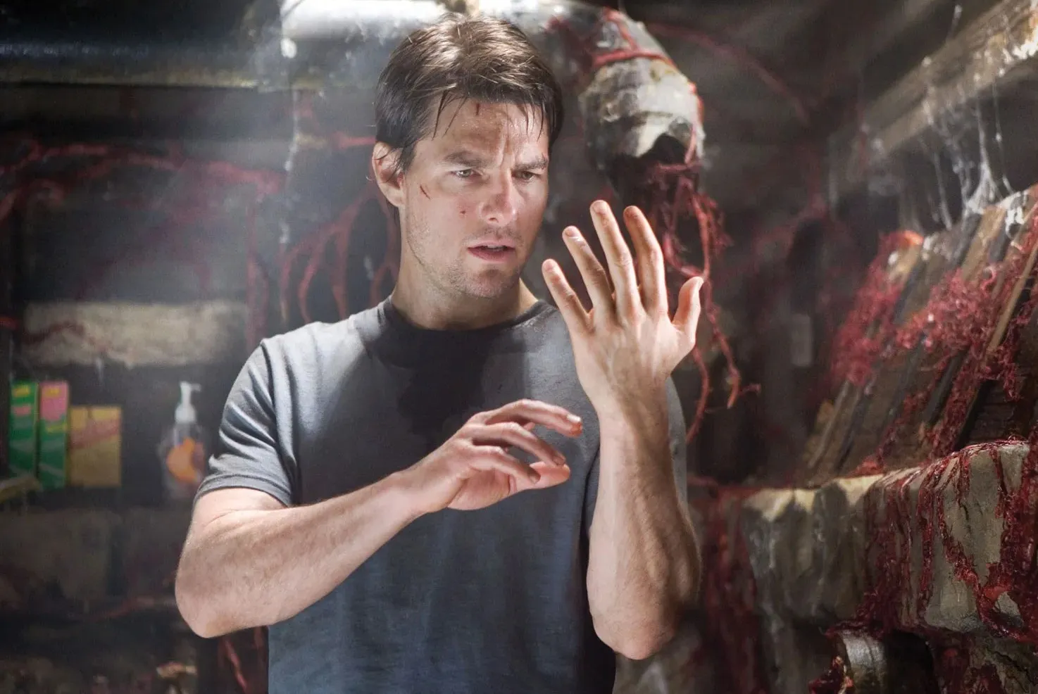 Tom Cruise looks at his hand in 'War of the Worlds.'