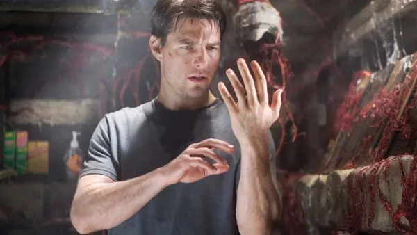 Tom Cruise looks at his hand in 'War of the Worlds.'