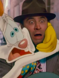 Roger Rabbit holds on to Eddie Valiant in a scene from 'Who Framed Roger Rabbit.'