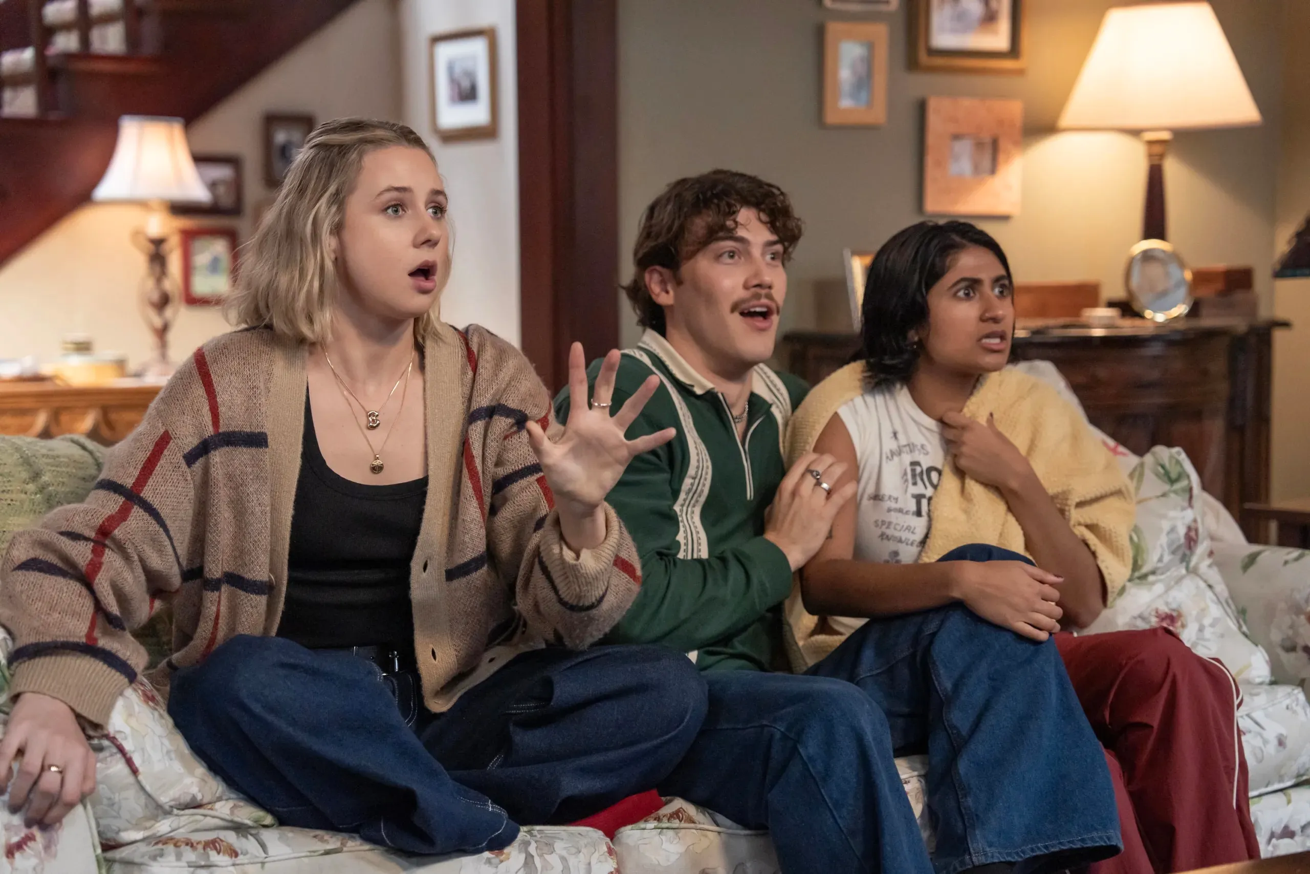 Lucy Freyer, Jack Innanen and Amita Rao sit on a couch in Adults