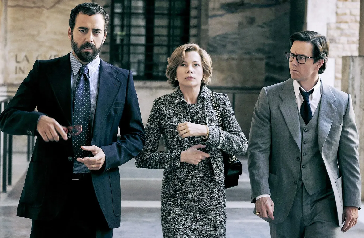 Three people walk in 'All the Money in the World.'