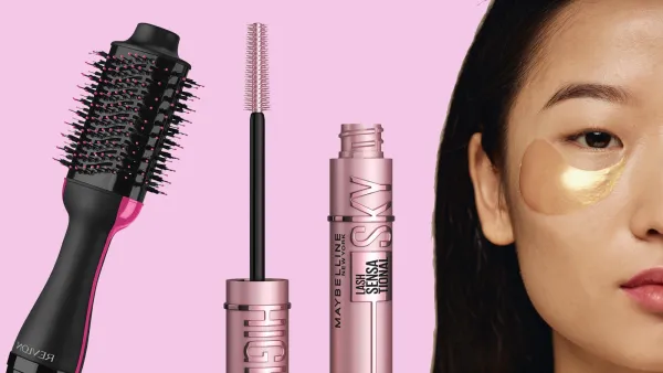 Crop half face closeup studio shot of young Asian woman with collagen patches under eyes looking at camera, copy space