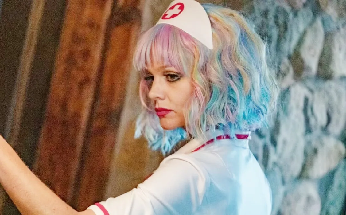 A woman looks back in 'Promising Young Woman.'