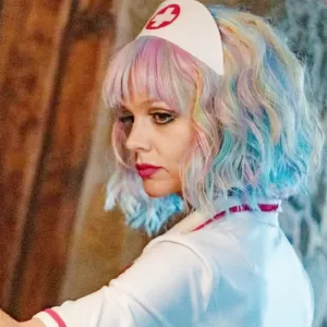 A woman looks back in 'Promising Young Woman.'