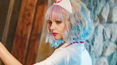 A woman looks back in 'Promising Young Woman.'