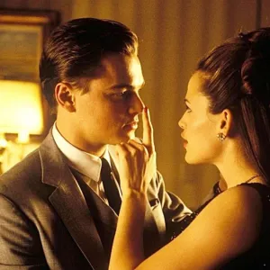 A woman touches a man's nose in 'Catch Me If You Can.'