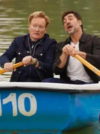 Two men row a boat in a lake in 'Conan O'Brien Must Go.'