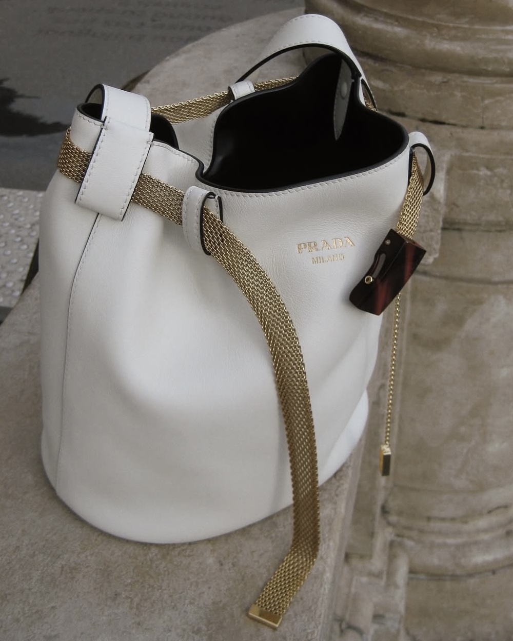prada belted buckle bucket bag white
