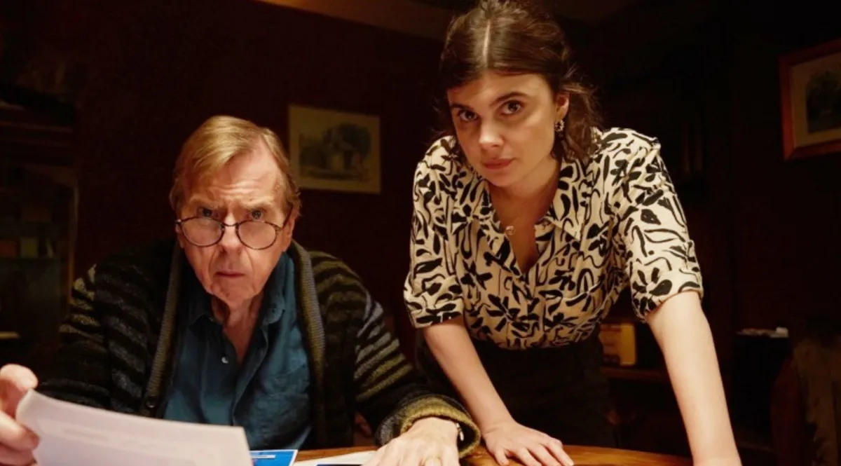 A man and a woman lean forward in 'Death Valley.'