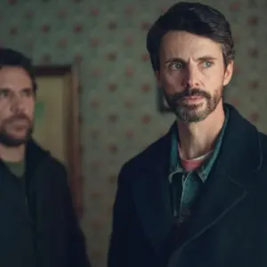 Two men stand in a room in 'Dept. Q.'