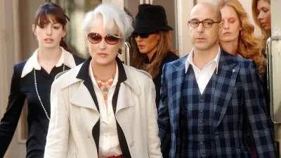 Three people exit a building in 'The Devil Wears Prada.'