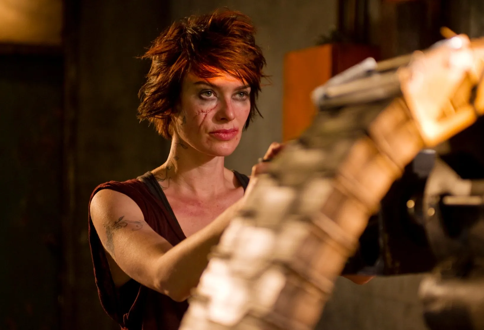 A woman holds a machine gun in 'Dredd.'