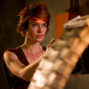 A woman holds a machine gun in 'Dredd.'