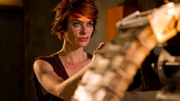 A woman holds a machine gun in 'Dredd.'