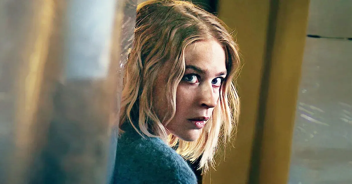 A blonde woman looks over her shoulder in 'Exterritorial.'