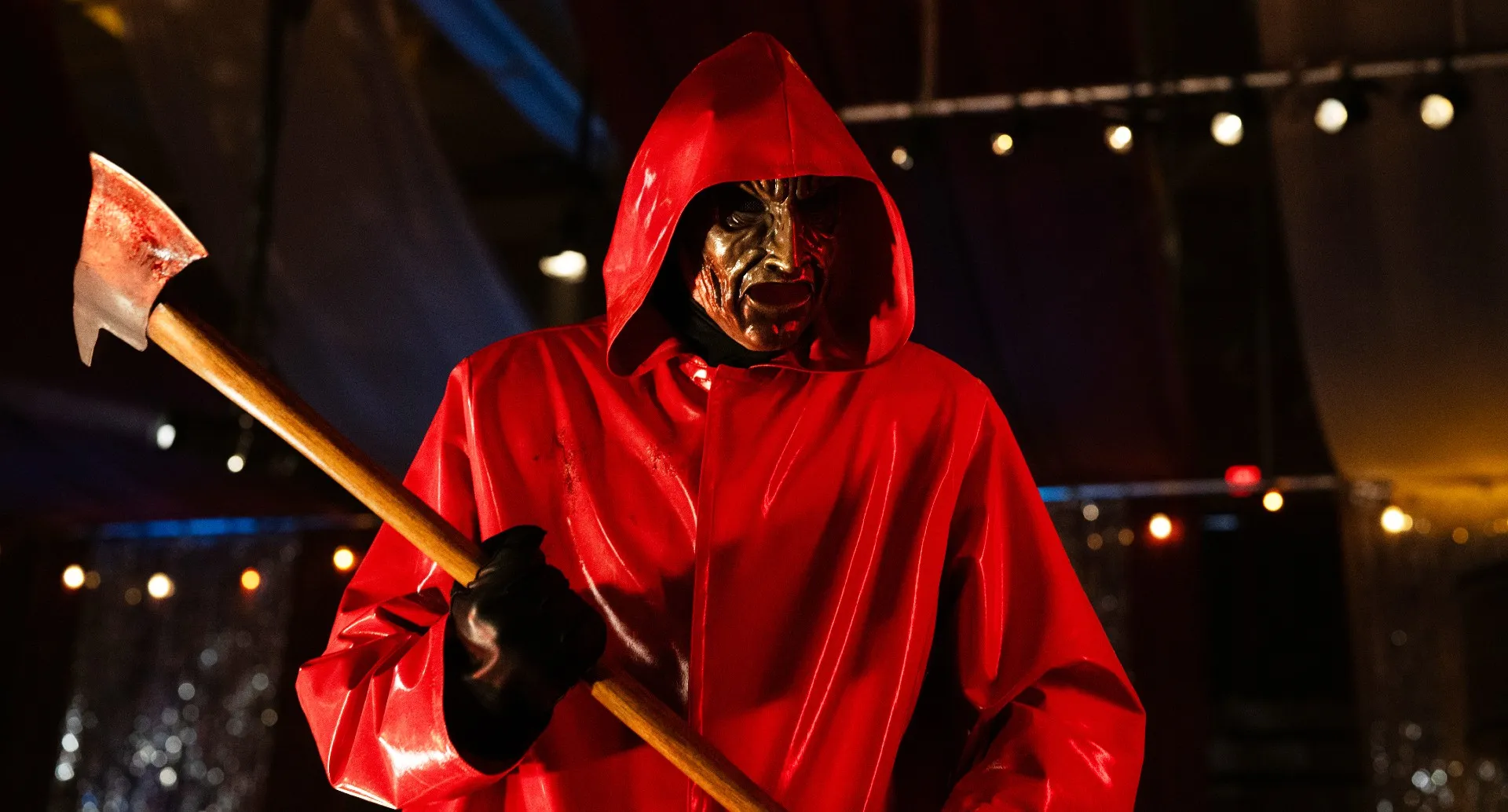 A man carries an axe in 'Fear Street: Prom Queen.'