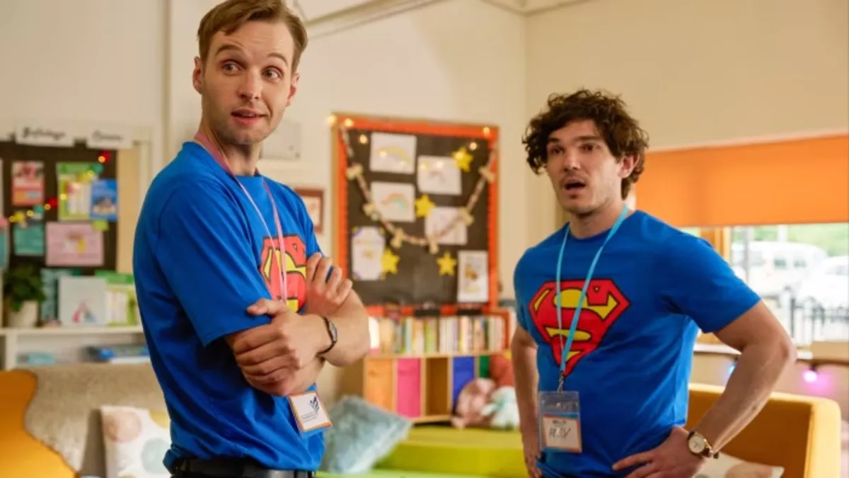 Two men stand in a playroom in 'Lost Boys and Fairies.'