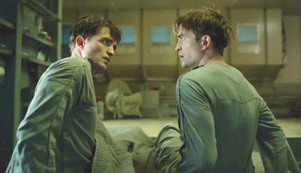 Two clones look at each other in 'Mickey 17.'