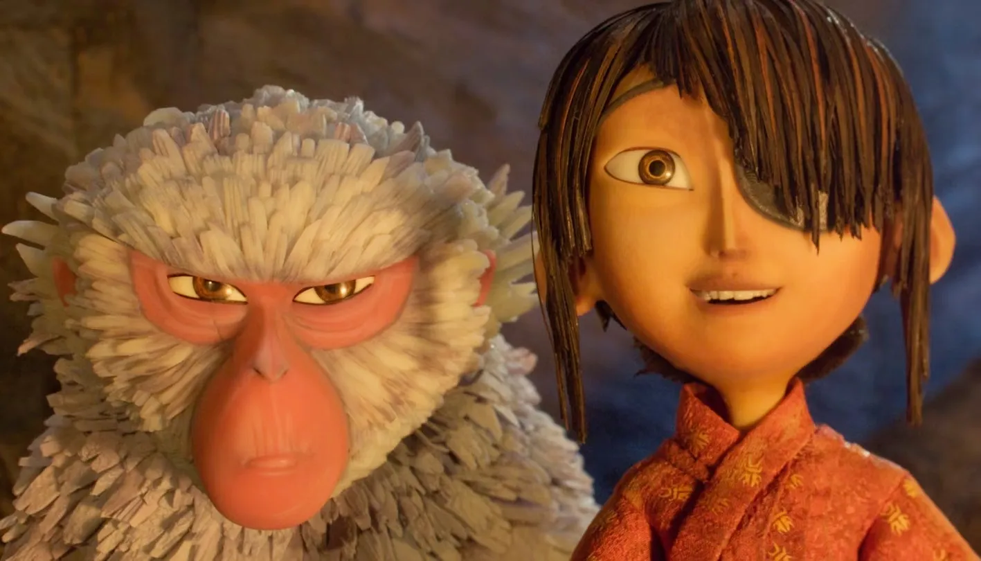 A boy and a monkey stand together in 'Kubo and the Two Strings.'