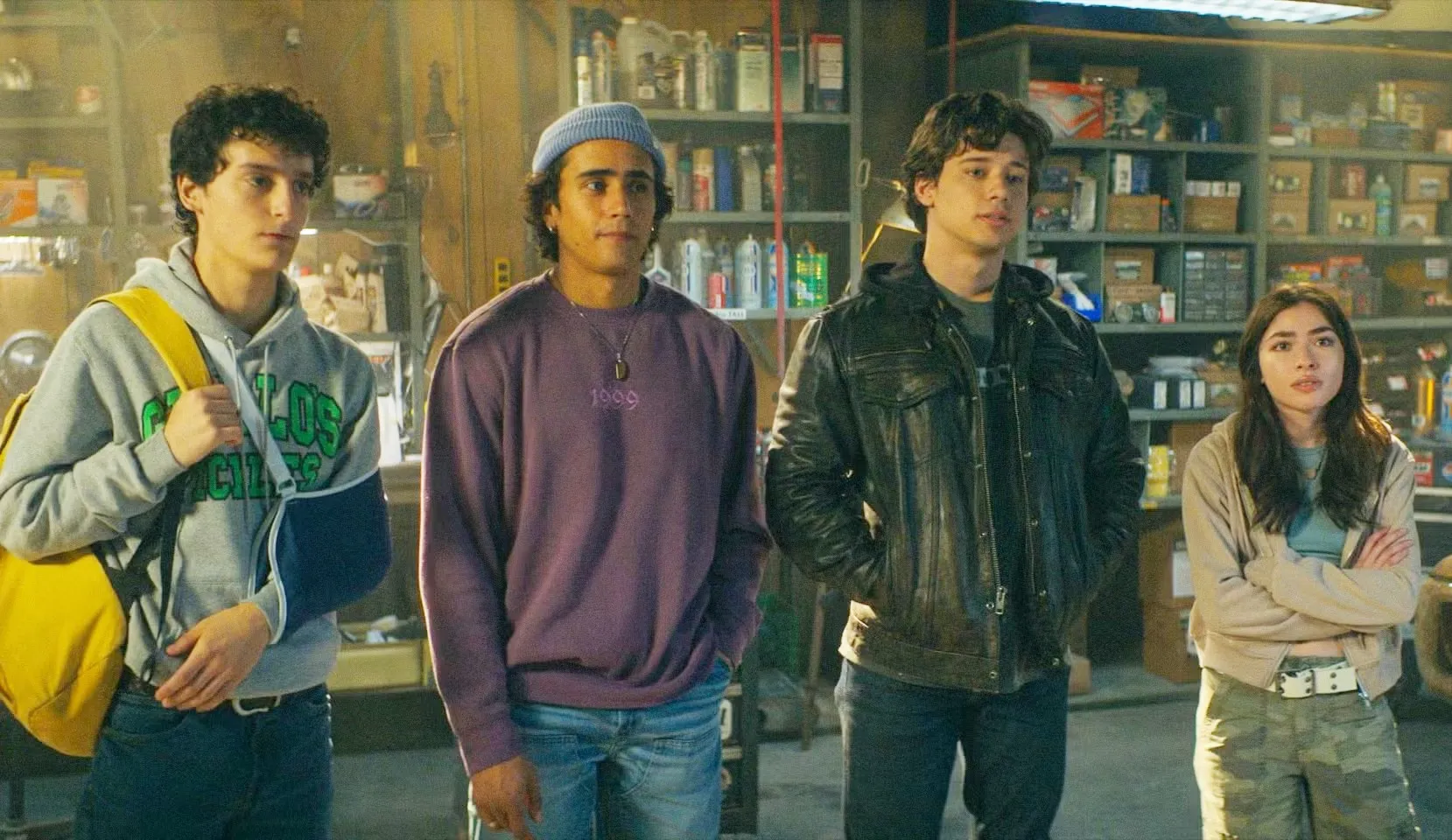 4 teens stand in a garage in 'Motorheads.'