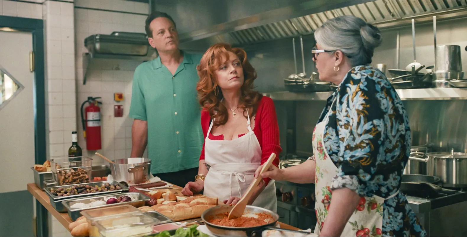 Three people argue in a kitchen in 'Nonnas.'