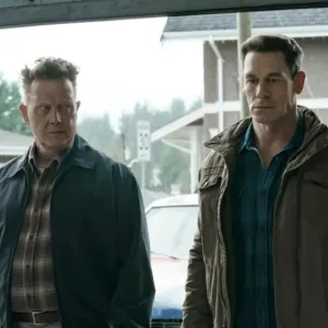 Two men stand side by side in 'Peacemaker.'