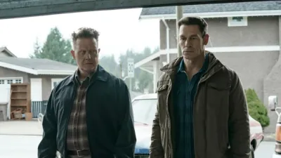 Two men stand side by side in 'Peacemaker.'