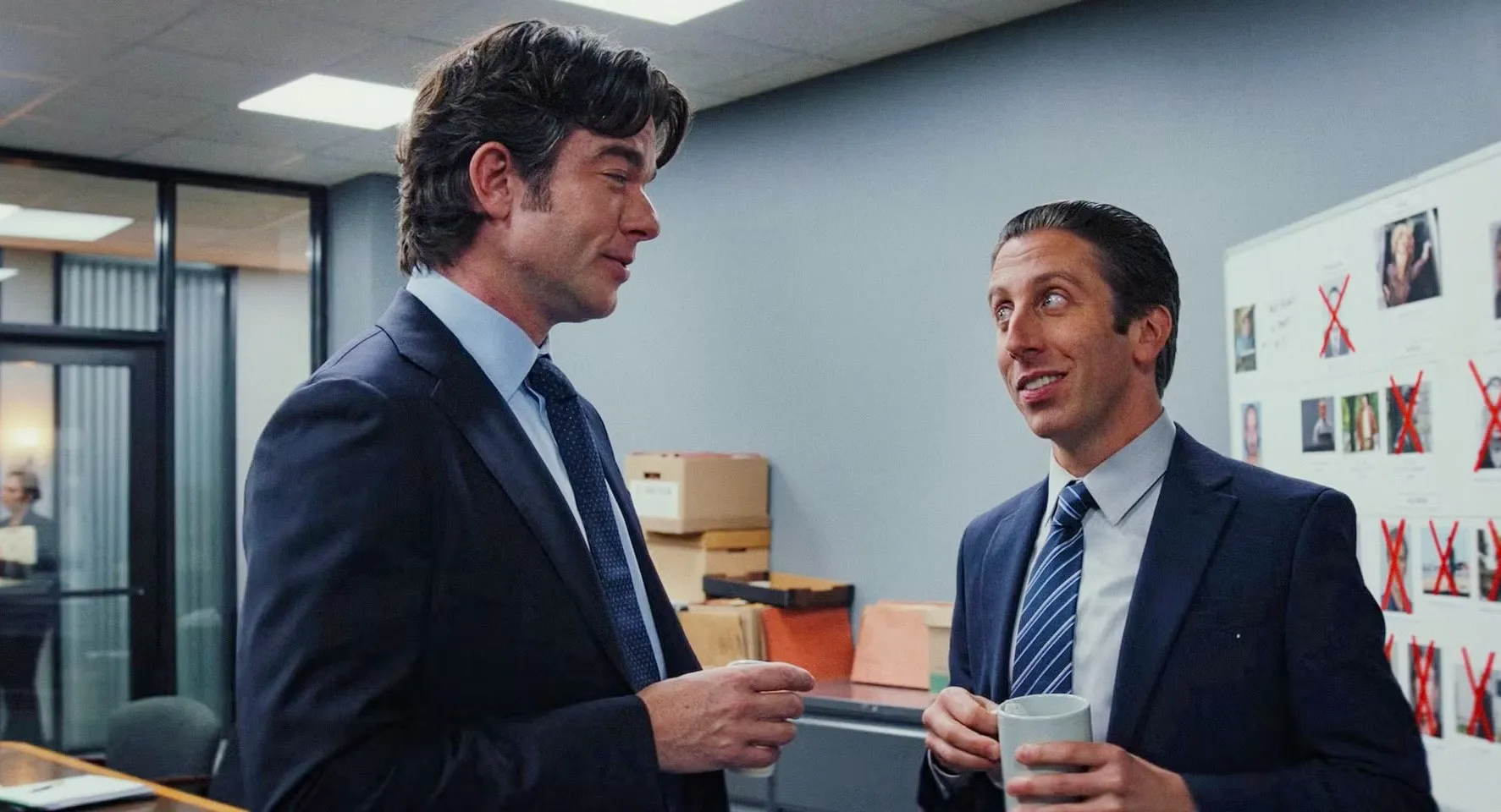 Two men talk and hold coffee in 'Poker Face' season 2.