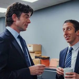 Two men talk and hold coffee in 'Poker Face' season 2.