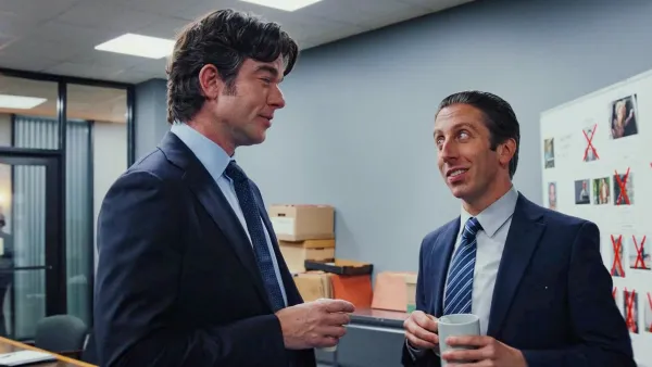 Two men talk and hold coffee in 'Poker Face' season 2.