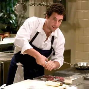 A man cooks in a kitchen in 'Spanglish.'