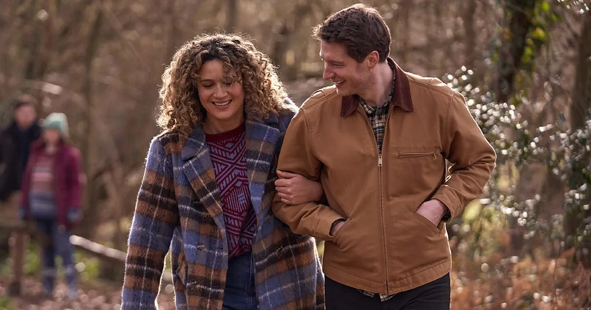 A woman walks with a man in 'Starstruck.'