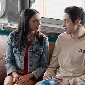 A man looks at a woman in 'The King of Staten Island.'