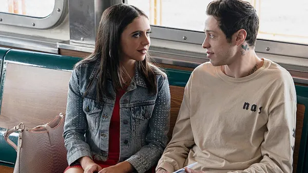 A man looks at a woman in 'The King of Staten Island.'