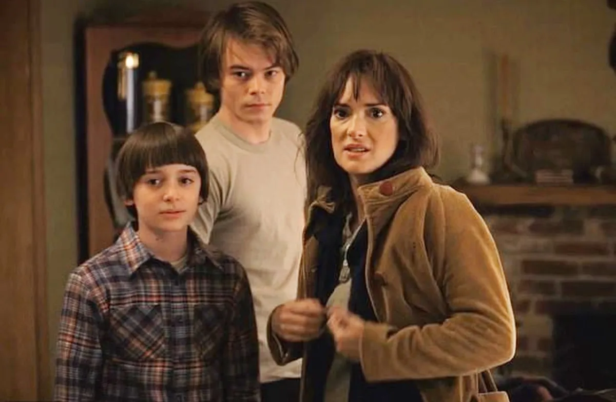 A mother stands with her two sons in 'Stranger Things.'