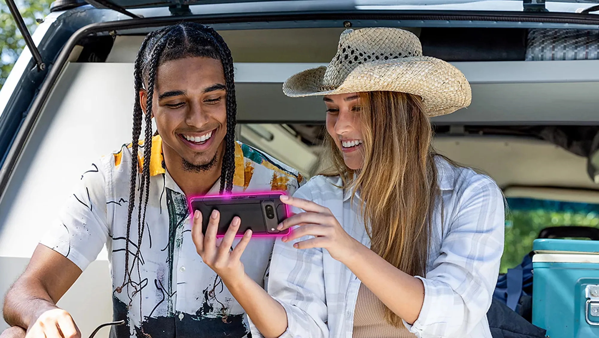 man and woman in car with phone for T-Mobile