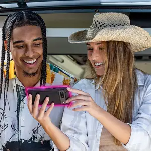man and woman in car with phone for T-Mobile
