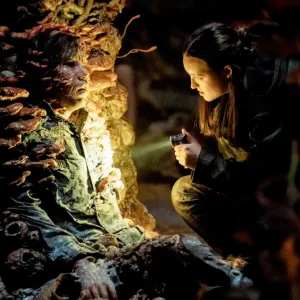 Ellie shines a flashlight on a monster in 'The Last of Us' season 2.