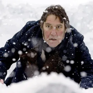 A man crawls through the snow in 'The Terror' season 1.
