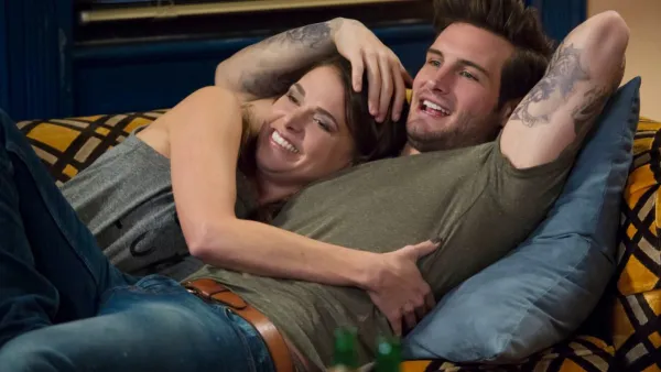 A man and a woman lie next to each other in 'Younger.'