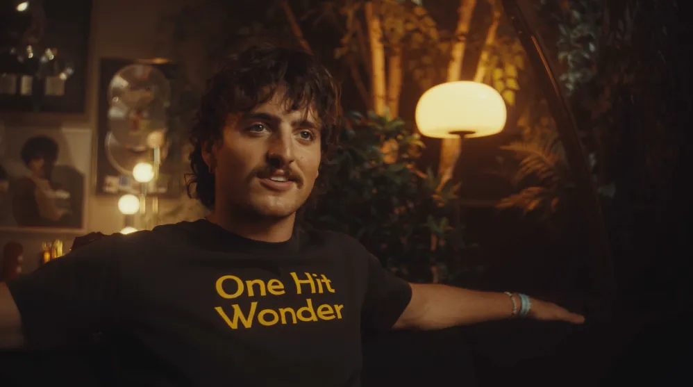 Benson Boone in his "Mr. Electric Blue" music video