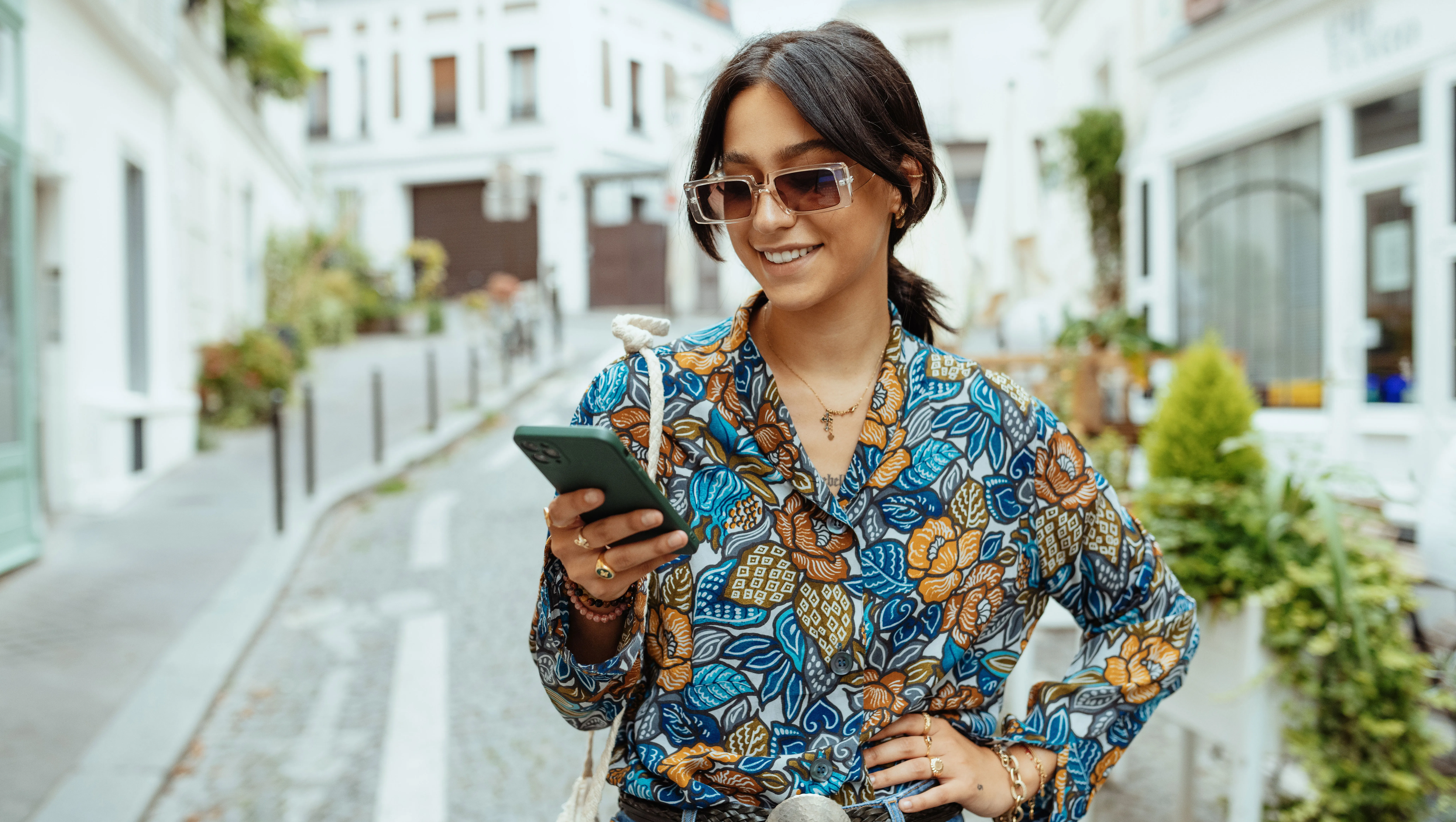 Fashionable millennial woman with sunglasses in city of Paris - stock photo