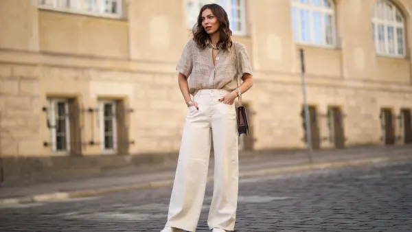 Masha Sedgwick (Maria Astor) wearing Nobi Talai blouse, Agneel bag, Closed jeans and Coach sneaker on May 06, 2020 in Berlin, Germany.