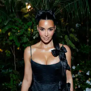 Kim Kardashian Poses Topless in a Risque Bedroom Photoshoot