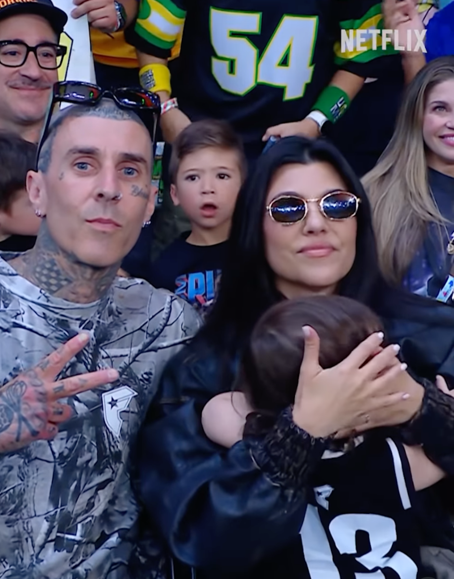 Kourtney-Kardashian-Cuddles-Up-With-Son-Rocky-While-Attending-WWE-Event-Alongside-Travis-Barker