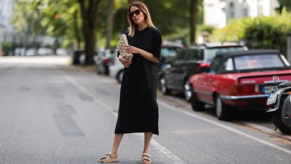 HAMBURG, GERMANY - JUNE 26: Elise Soho wearing Bruna the Label jewelry, beige Zara bag, beige Ducie London sandals and black Soho Studios midi dress on June 26, 2021 in Hamburg, Germany. (Photo by Jeremy Moeller/Getty Images)