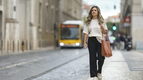 Tourist waiting for a bus in Lisbon